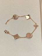 STAR AND SUN 5 MOTIF MOP PINK GOLD BRACELET