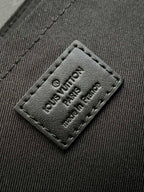S-CAPE MESSENGER BAG 28 IN BLACK MONOGRAM ECLIPSE CANVAS