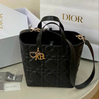 MEDIUM TOUJOURS BUCKET BAG 22 IN BLACK CANNAGE CALFSKIN