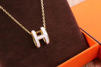 HM CLIC YELLOW ENAMEL GOLD NECKLACE