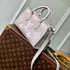ONTHEGO EAST WEST BAG 25 IN BICOLOR MONOGRAM EMPREINTE LEATHER