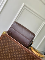 SPEEDY BANDOULIERE 25 IN DARK BROWN MONOGRAM EMPREINTE CALFSKIN EMBOSSED LOGO