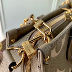ONTHEGO EAST WEST BAG 25 IN GREEN MONOGRAM EMBOSSED COWHIDE