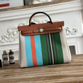 HERBAG ZIP 31 LAQUERED BAG IN GREEN MIX BLUE H PLUME CANVAS