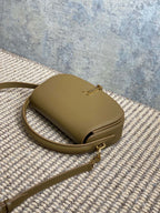 VOLTAIRE HALF-MOON SHOULDER BAG 24 IN CEDAR BROWN CALFSKIN GOLD METALLIC